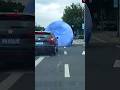 A giant moon balloon rolled through traffic in China 😅 #shorts