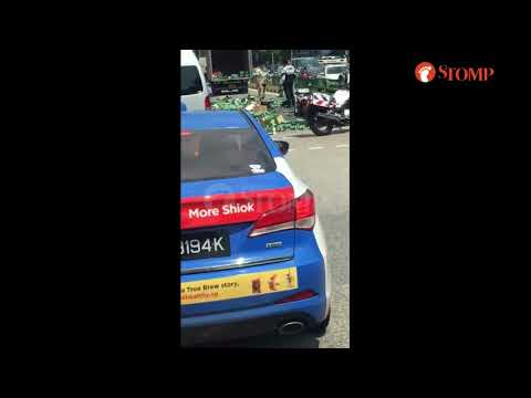 Definitely not happy hour for man picking up hundreds of beer cans that fell off van in Yishun (1)