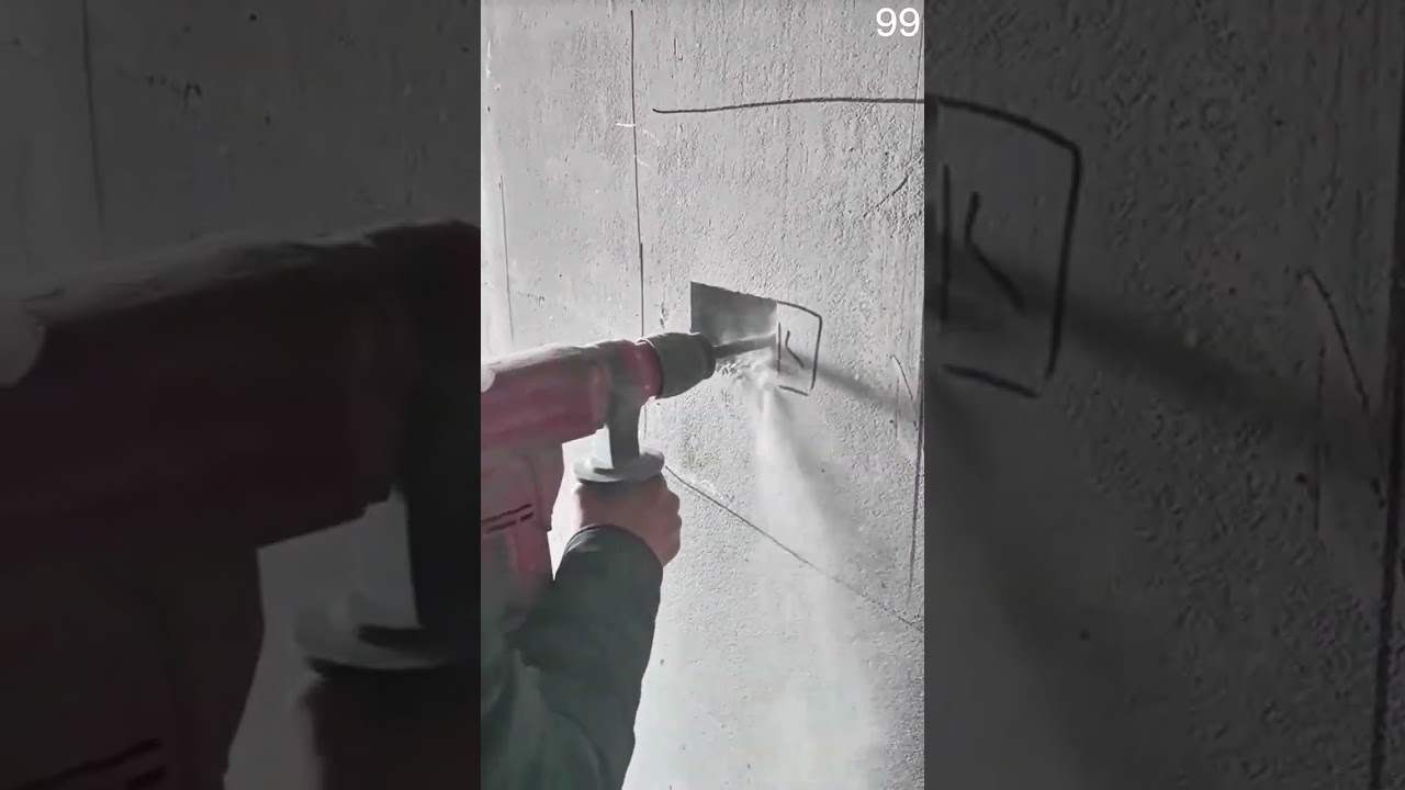 Hammer drills concrete dust rises rectangle carved precise