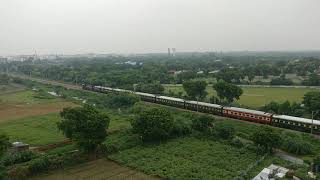 Bandra Terminus - Delhi Sarai Rohilla Garib Rath Express Ariel View on its last leg of Journey
Location: Gurgaon, Haryana
27th August 2015, 1029 Hrs
Train: 12216 Mumbai Bandra Terminus - Delhi Sarai Rohilla Garib Rath Express
Loco: Tughlakabad(TKD) WDP-4B#40078
Posting after a long time. Got to capture this from my construction site on outskirts of Delhi. TKD WDP-4D with 12216 Mumbai Bandra Terminus - Delhi Sarai Rohilla Garib Rath Express slowing down as it sees the Amber on home signal of Bijwasan. The green livery of the train camouflage with lush green surrounding. Bandra Terminus - Delhi Sarai Rohilla Garib Rath Express Ariel View on its last leg of Journey