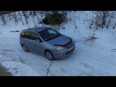 Видео "Сузуки Лиана/Suzuki Liana (полный привод) 4х4, подъем на крутую, скользкую гору зимой"