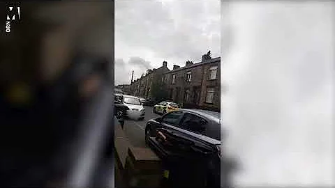 Man on rooftop stand off with police