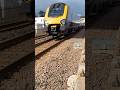 Cross country class 220 clatters down the seawall , kings parade Dawlish-Plymouth service 220028