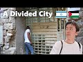 Hebron a city divided between palestinians and israelis  behind the wall