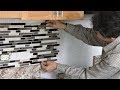 Install backsplash tile in kitchen