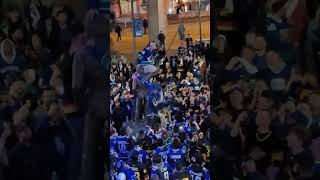 Canucks fans scaled the Roger Nielsen statue following the Game 1 win to add a rally towel