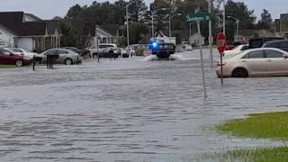 Police Hummer driving through flood water.