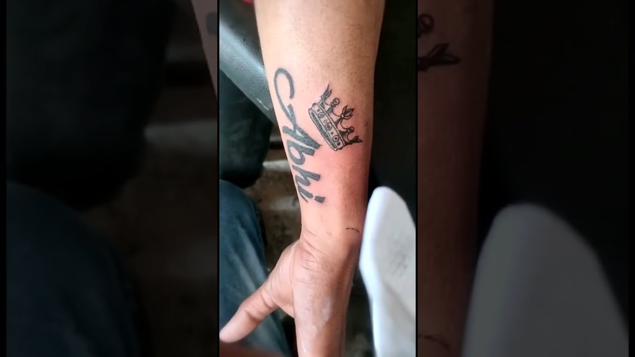 Small video of name tattoo: Name Tattoo with small heart beat and heart.  Made this small tattoo on wrist. Thanks to an old client who took her  sister to... | By Angel