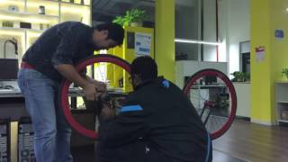 Ma Xiang and me fixing the fixie wheel