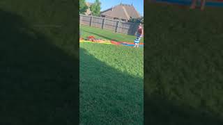 Woman uses boogie board to go down slip n slide and faceplants