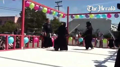 Siblings Terry and Whitney Langford battle each other during a kendo demonstration at the Salinas Ob