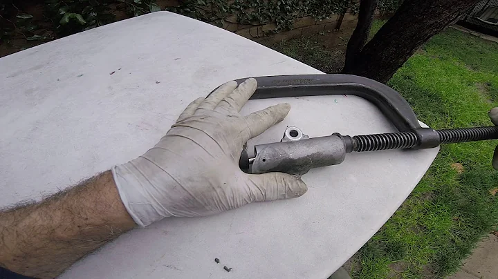 Compressing timing belt tensioner