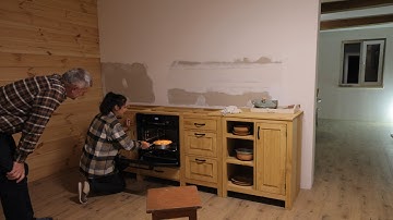 Country life in a remote village. Unpacking furniture. Apple pie by the fireplace