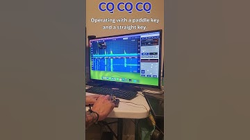 Calling CQ three times using two different Morse code keys: a paddle key and a straight key.