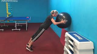 Swiss ball wall press ups