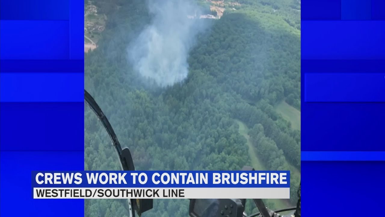 Firefighters continue to battle brush fire in Southwick - YouTube