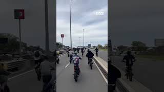 Police called after dozens of e-bike 'hoons' ride over Sydney Harbour Bridge