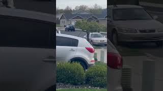 Driver chases after kid riding dirt bike on sidewalk