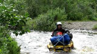 ATV crossing river in Finnmark