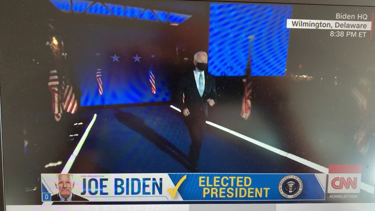 Joe Biden jogs on stage November 7, 2020
