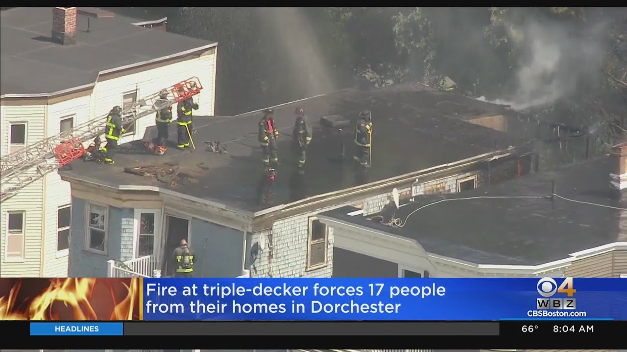 17 displaced after fire rips through Dorchester home - YouTube