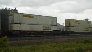 2 engine BNSF double stacked train in the rain heading East through Big Lake, MN