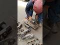 ONE BOLT HEAD AFTER ANOTHER: KNOCKING DOWN BOLTS ON EXCAVATOR'S TRACK SHOE IN CHECKING FITTING