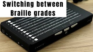 Navigating between Braille grades / system menu