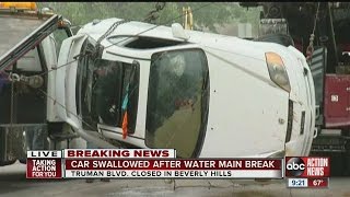 Car swallowed by hole after water main break in Citrus County