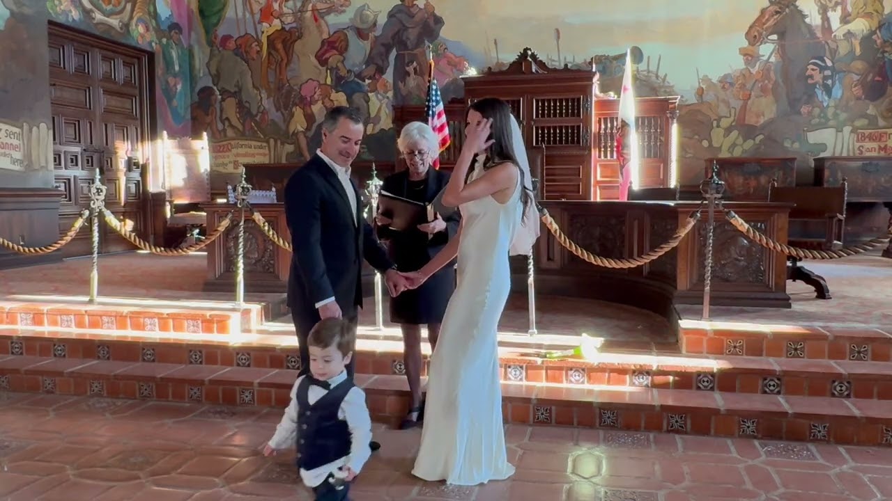 Man and woman get married by the alter then little boy falls while leaning on the bride
