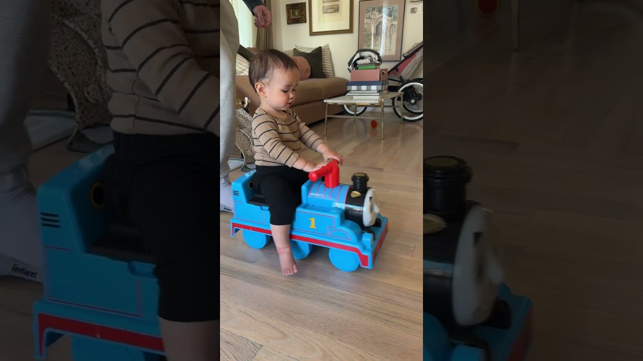 Boy gets pushed by Dad on Thomas the train toy car then falls back