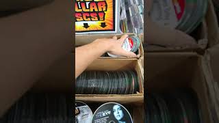 Youre looking though discs in the 1$ bin at The Cave, while the DK Rap player 2 remix is playing.