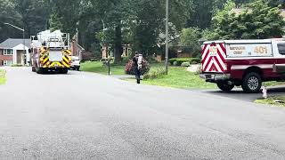 Engine 404 bringing hose packs at a house fire scene