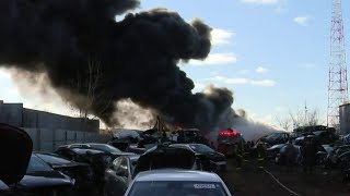 Crews respond to massive fire at junkyard on Detroit's west side