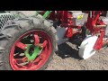 3-row Jang seeder on electric Planet Jr walk-behind tractor