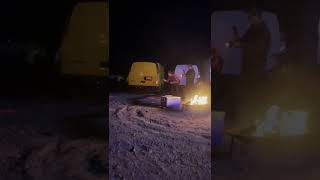 Guy Pulling a Loop Out on a Dirt Bike Over a Fire Pit Smacks Against a Trailer