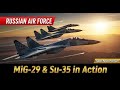 Russian Air Force MiG-29 and Su-35 jets flying over desert landscape — dramatic sunset sky.