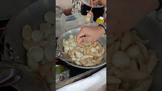 On Frying Fish Balls Kikiams & Checken Balls Walk Vendor Selling To The People Pers By