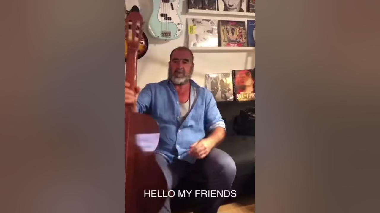 King Eric cantona plays the guitar and singing a song