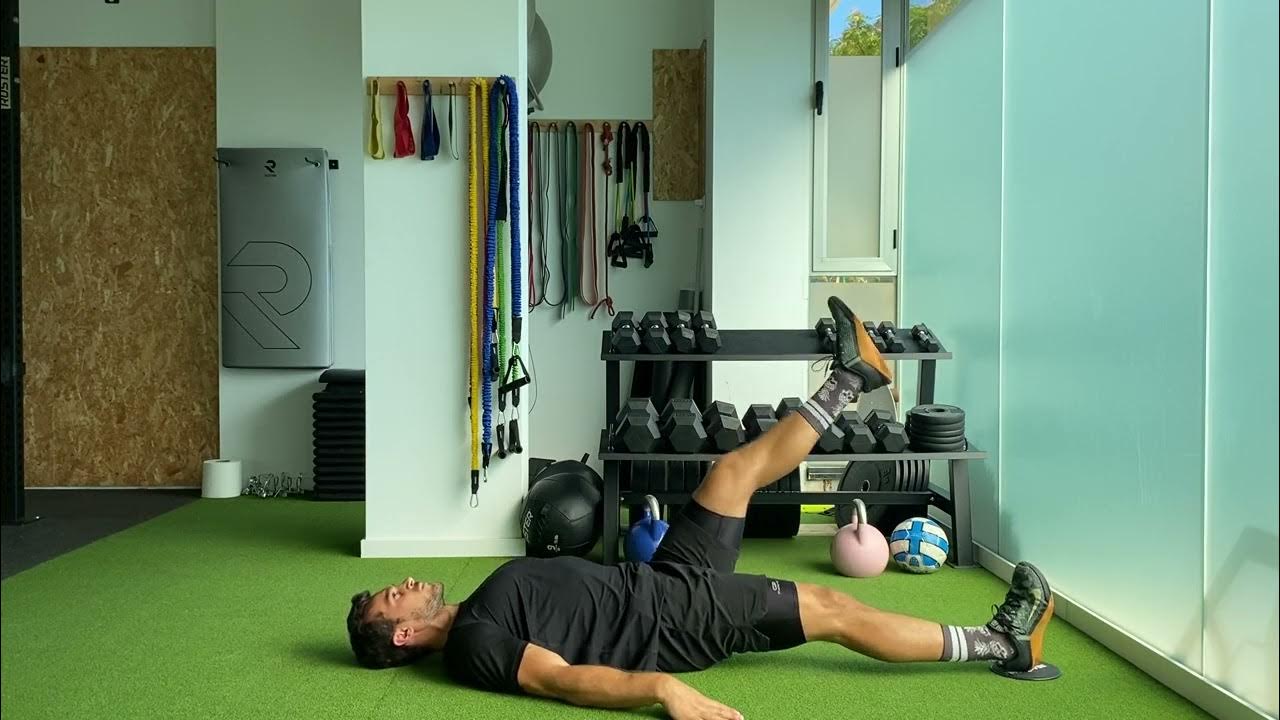 Single leg Eccentric Slider Glute Bridge Puente de glúteo excéntrico