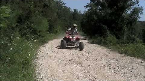 Polaris Predator 500 skiding and accelerating in a wood using several camera views [2]