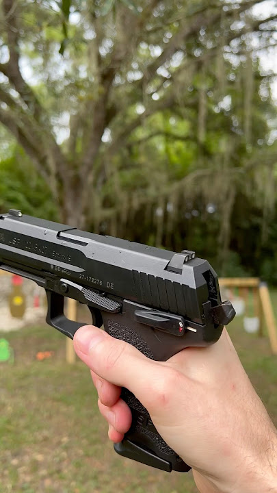 How do you decock a USP Compact pistol? [drop hammer without firing]