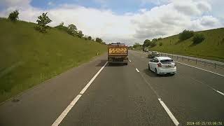 M65 Fox Brothers 32T HGV fully loaded, driver obviously not concentrating, drifts onto shoulder