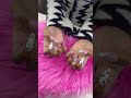 Painting the nail tips with colorful polka dots