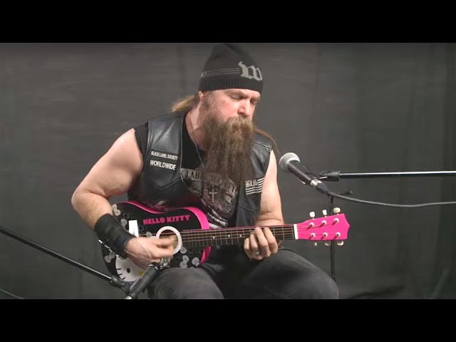 Zakk Wylde Plays Black Sabbath on Hello Kitty Mini-Guitar class=