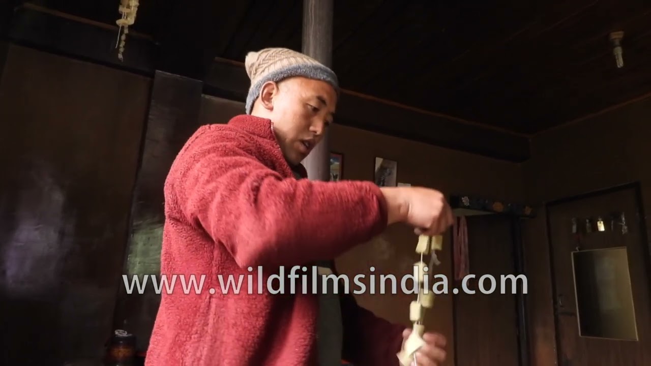 Chhurpi or dried Yak's cheese is hard as stone: Sikkimese yak herder dries chhurpi in his tea shop