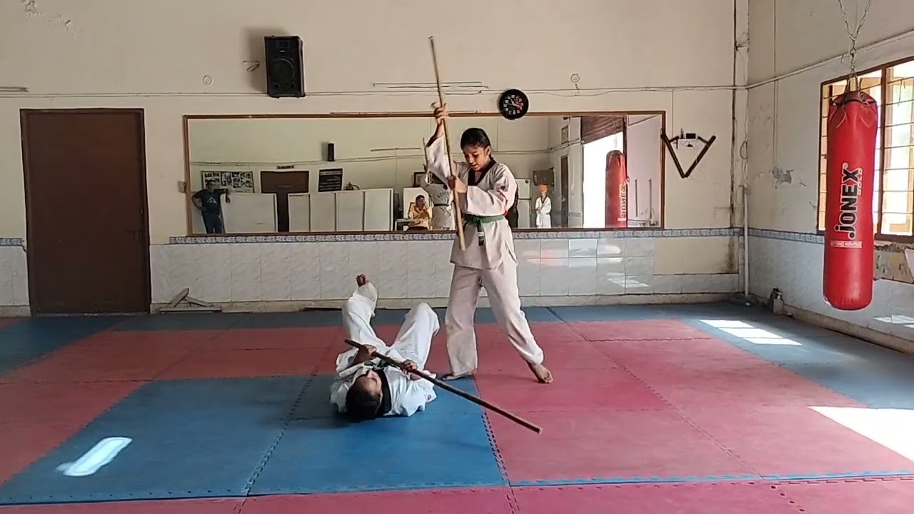 Taekwondo Belt Test Martial Arts weapon self-defence with Lathi long stick Bo staff attack defence