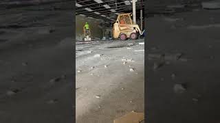 VCT tile floor demo. With bobcat scraper