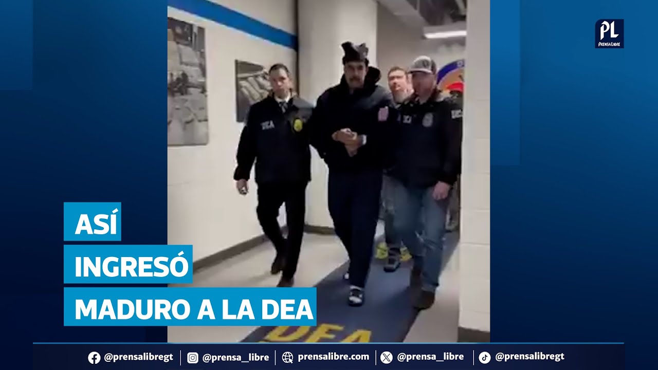 Secuestrado presidente Maduro hace el signo de la paz mientras es custodiado por la DEA