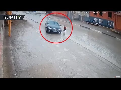 Dramatic video: Driver narrowly avoids hitting boy as he runs across road